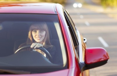 girl traveling by car smiling